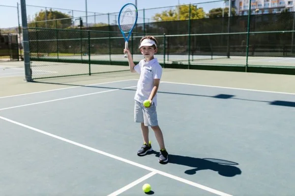 young tennis player training